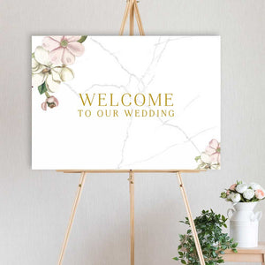 wedding welcome sign with pink and white flowers