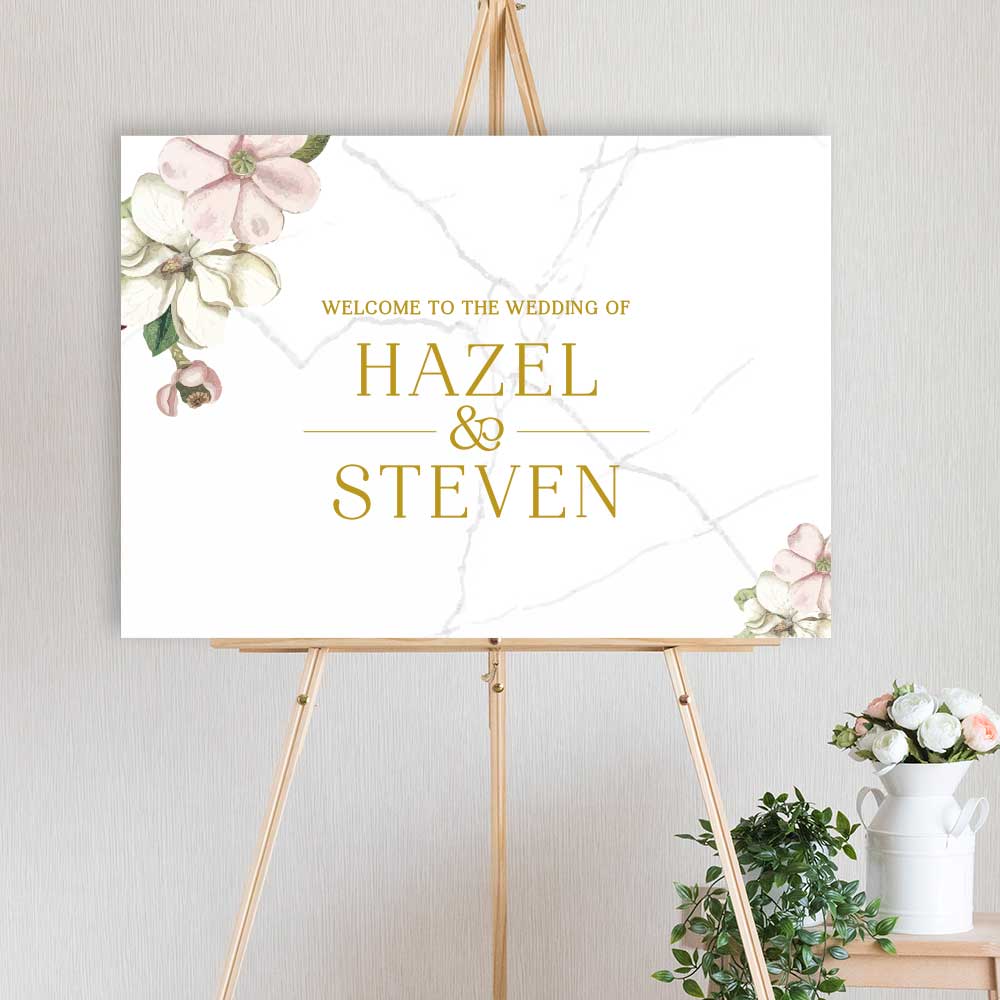 watercolour floral designed welcome sign for wedding, engagement or birthday party, sitting on a timber easel
