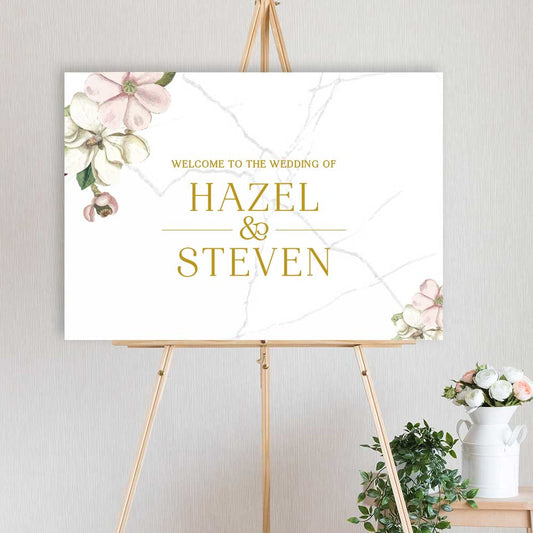 watercolour floral designed welcome sign for wedding, engagement or birthday party, sitting on a timber easel