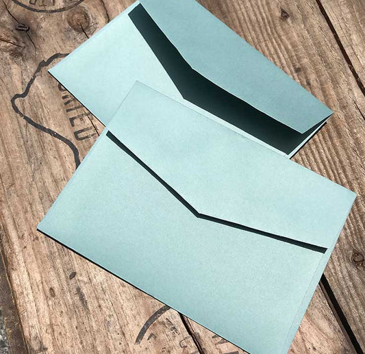 eco grande sage green envelope closeup