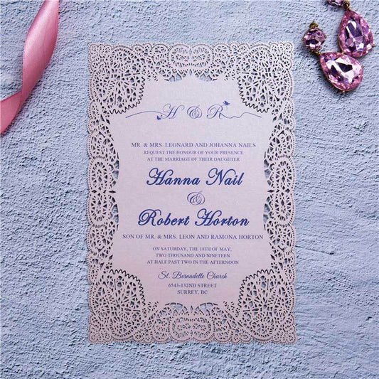 Laser-cut Wedding invitation featuring lace design around the border in blush pink