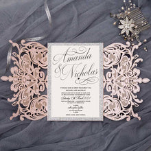 Blush pink laser-cut wedding invitation open