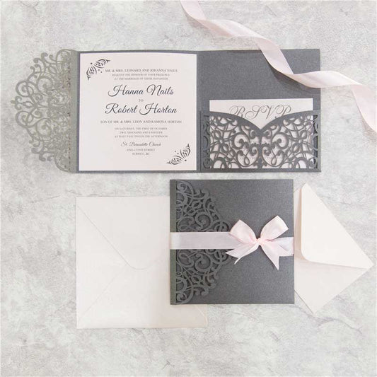 grey laser-cut invitation with pink ribbon set