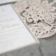 blush pink laser cut invitation with silver glitter detail
