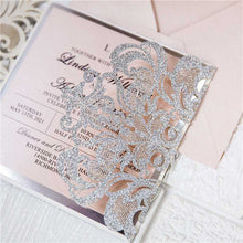 silver glitter laser cut invitation with pink ribbon detail