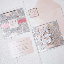 silver glitter laser cut invitation with pink ribbon