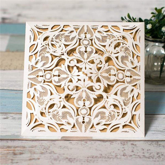Four quad folded laser-cut invitation in white