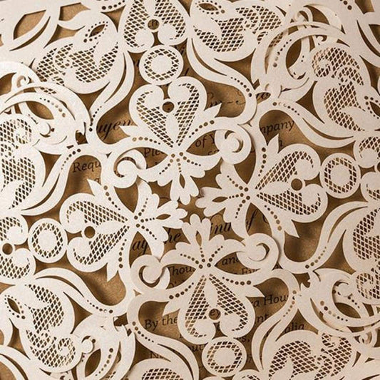 Four quad folded laser-cut invitation in white detailed