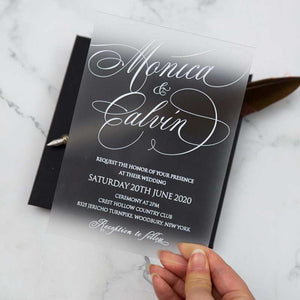 white frosted acrylic wedding invitation hand
