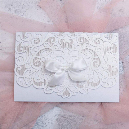 Graceful Heart - Laser-cut Tri-fold Pocket (closed) in white shimmer shown with white bow