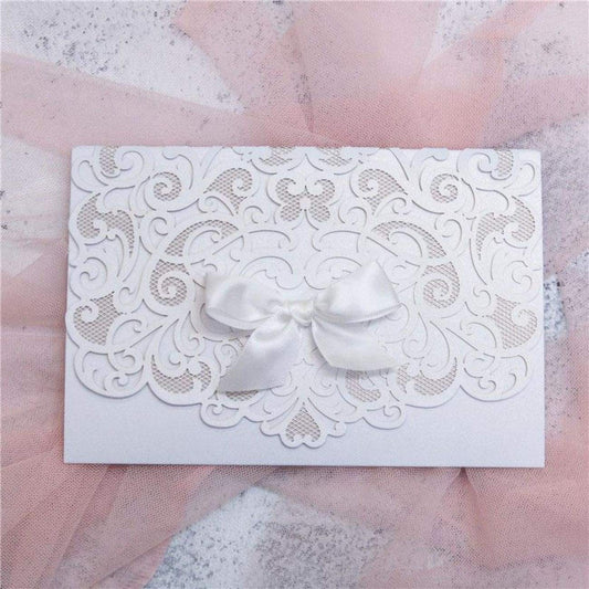 Graceful Heart - Laser-cut Tri-fold Pocket (closed) in white shimmer shown with white bow