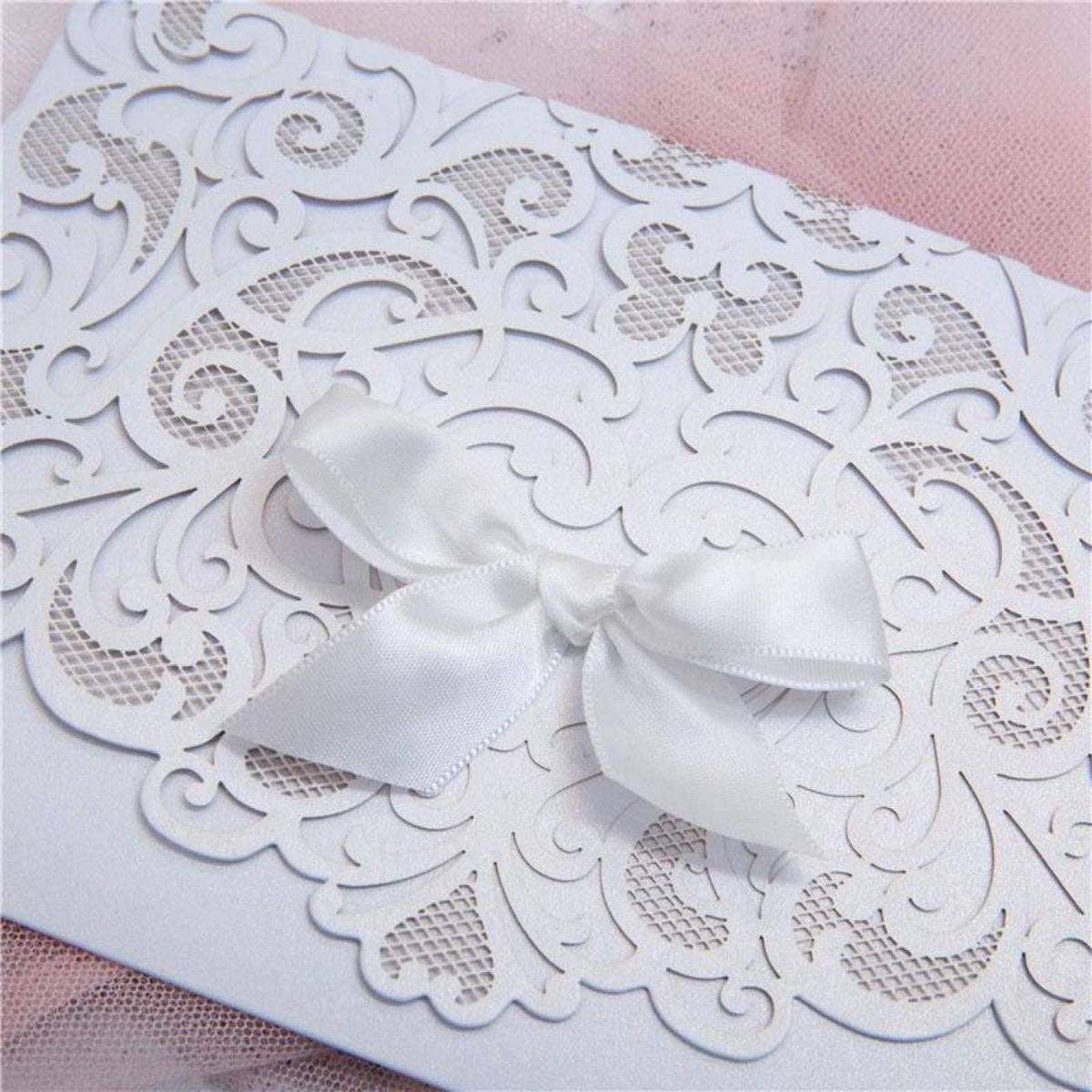 Graceful Heart - Laser-cut Tri-fold Pocket (closed) in white shimmer, featuring white bow, detailed