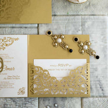 gold laser-cut wedding invitation open