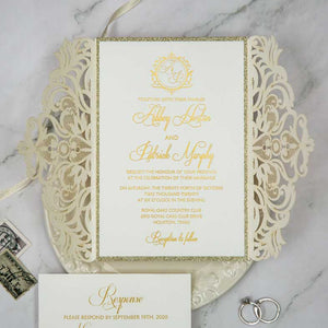 ivory laser-cut invitation gold foil open