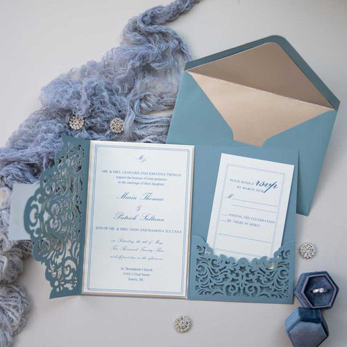 laser-cut dusty blue laser-cut wedding invitation