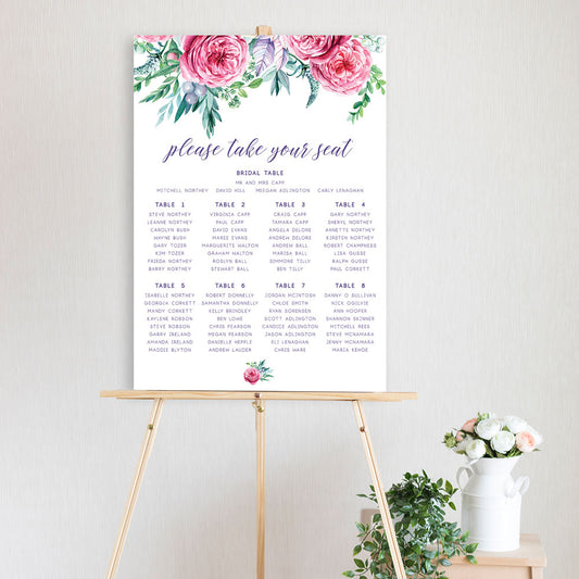 table seating chart featuring pink watercolour peonie flowers, sitting on a timber easel