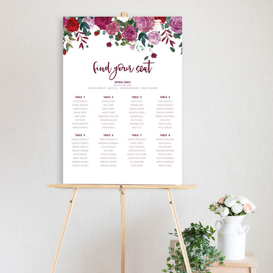 table seating chart featuring watercolour peonie flowers in burgundy and pink sitting on a timber easel