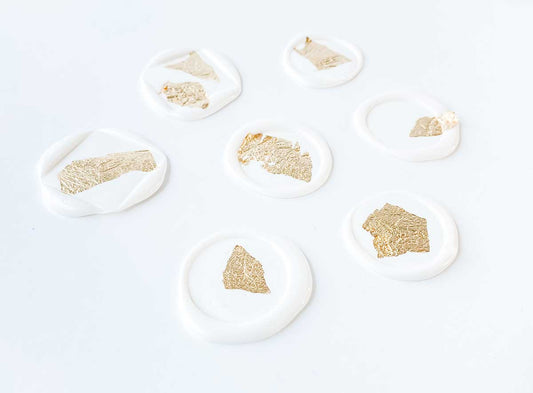 gold foil on white wax seal group