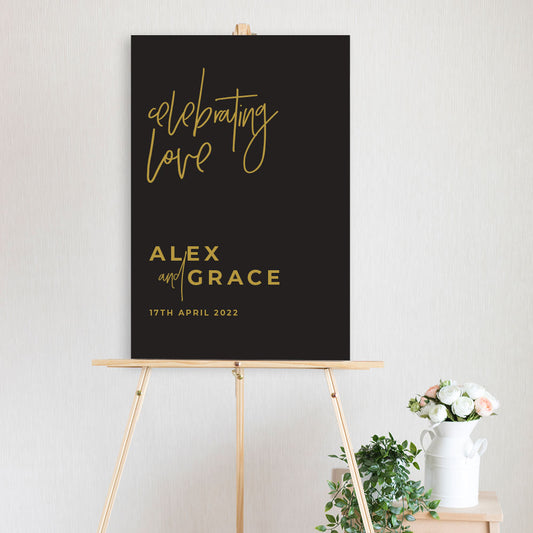 black and gold celebrating love welcome sign on timber easel wedding, engagement, birthday 