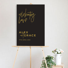 black and gold celebrating love welcome sign