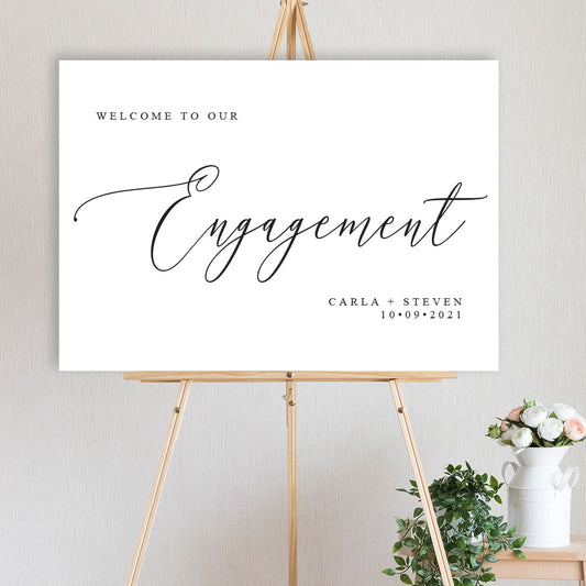 classic black and white engagement party welcome sign on timber easel