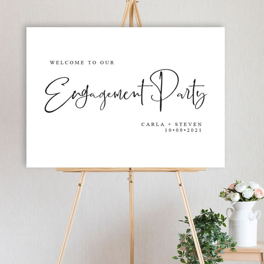 classic black and white engagement party welcome sign on timber easel