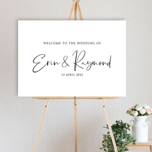 black and white modern script welcome sign on timber easel