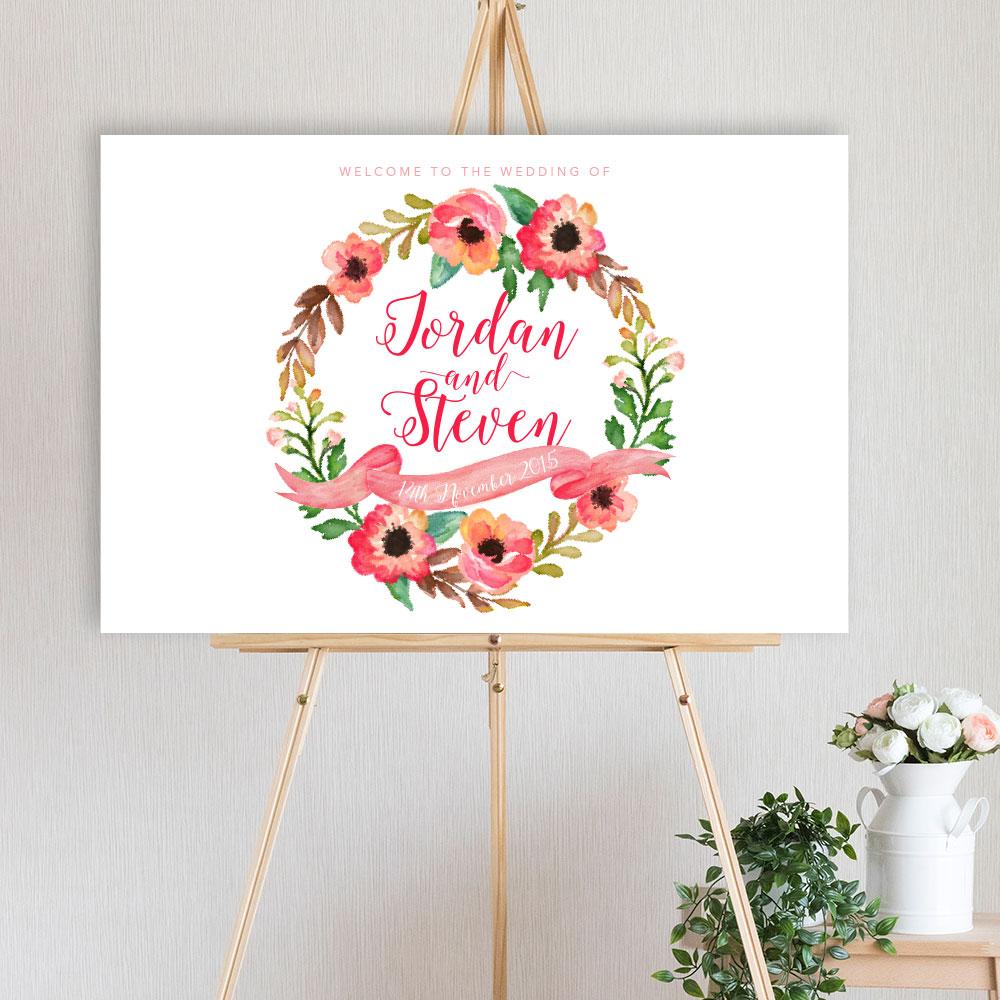 watercolour floral wreath designed welcome sign for wedding, engagement or birthday party, sitting on a timber easel