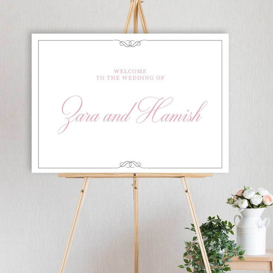 classic pink and grey welcome sign for wedding, engagement or birthday party, sitting on timber easel